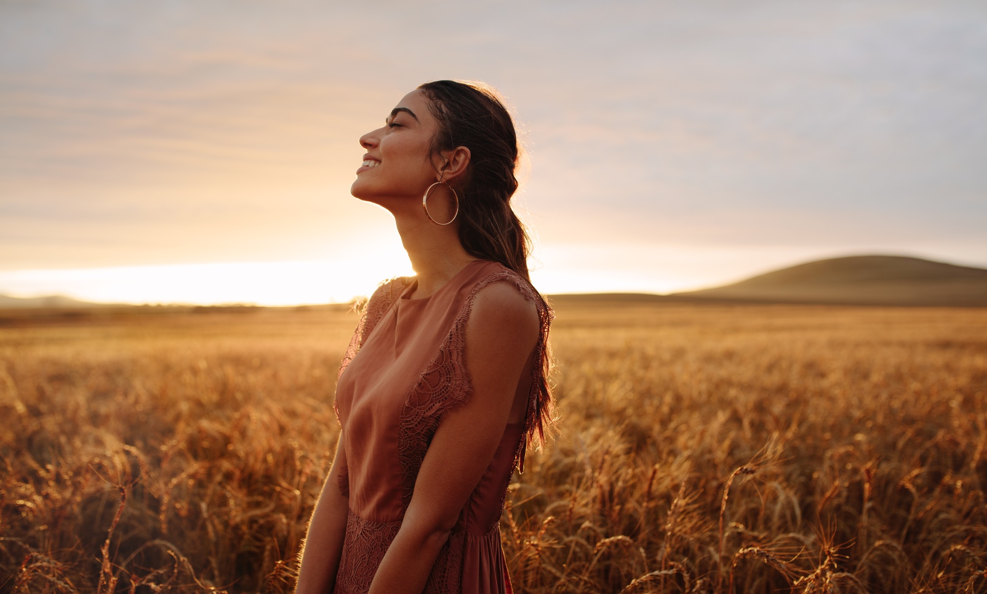 Happy woman enjoying in the nature