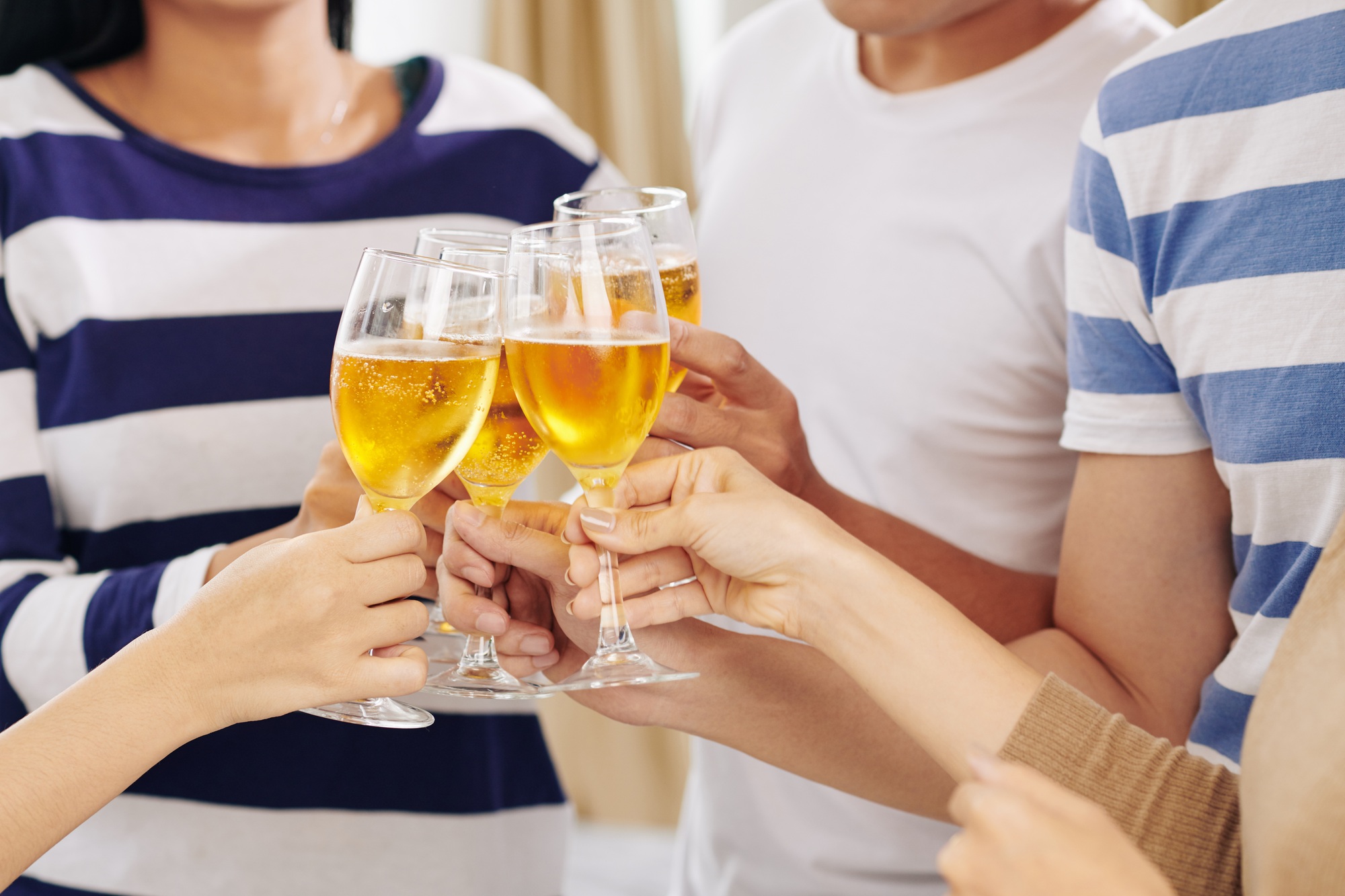 Party guests drinking champagne at party